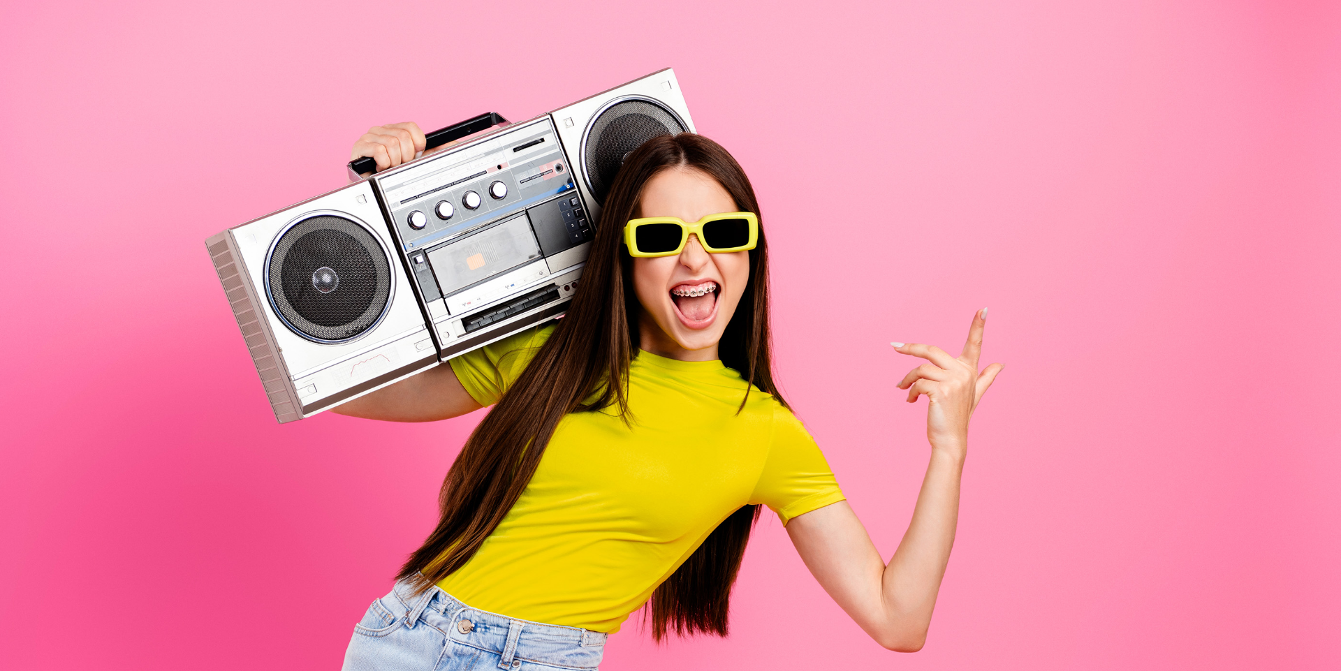 girl with sunglasses and boombox on shoulder
